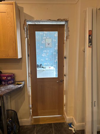 Removal of arch, plastering, door frame and oak door fitting.